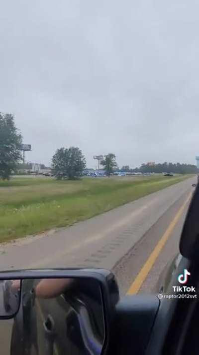 Suspect is apprehended in a sea of flashing blue lights