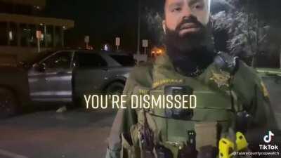 Cop who is giving a man a hard time is shut down by his supervisor