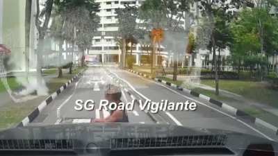 man was seen pointing his middle finger & pretended to be hit by a car after the car had honked at him.