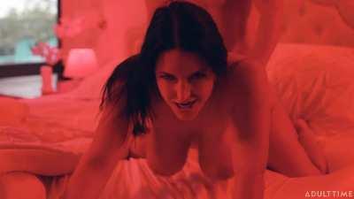 Angela White under thematic lighting