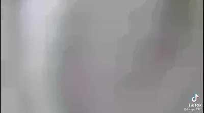 Cop covers a porch camera before knocking on the door