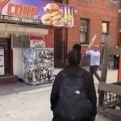 woman threatens Joe Rogan look-a-like w a 2x4 - doesn’t end well for her