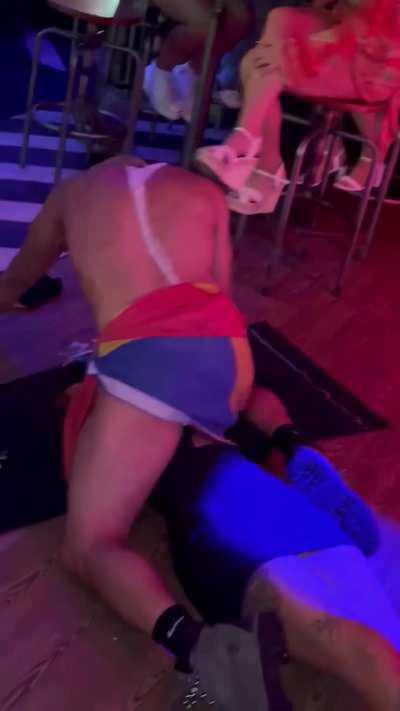 Male stripper rubbing his cock on hottie's body.
