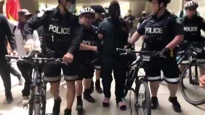 Justin Trudeau shows up at George Floyd protest in Toronto and is escorted out by police