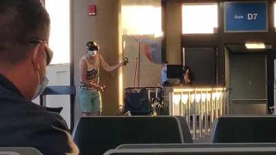 Man seen at Phoenix International Airport playing Beat Saber
