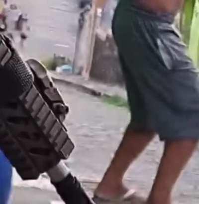 Ridiculous thug points gun at their friend