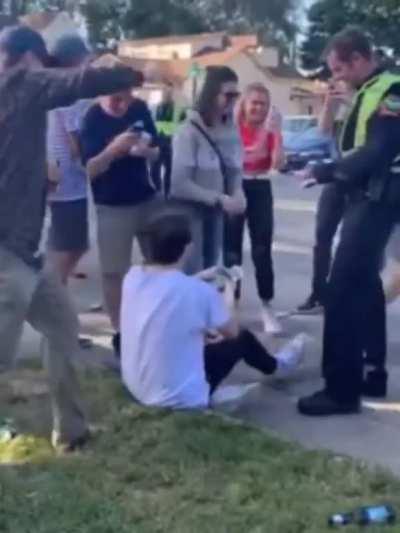 Cop starts giving him a drinking ticket, so everybody starts giving him money to pay it off.