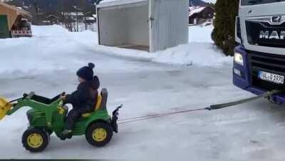 Dad, I wanna tow that truck with my tractor.. you can't son.. Truck's driver: