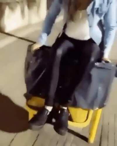 Sitting on a trash bin