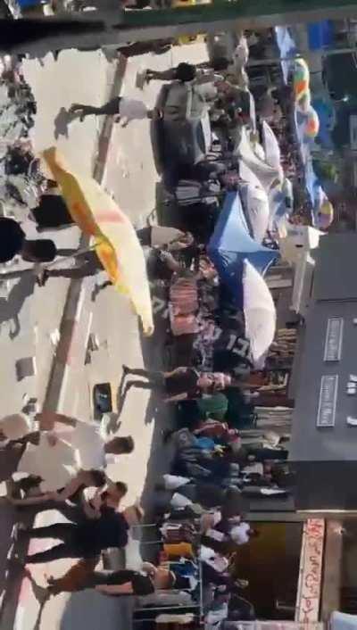 A crowd fights for no apparent reason