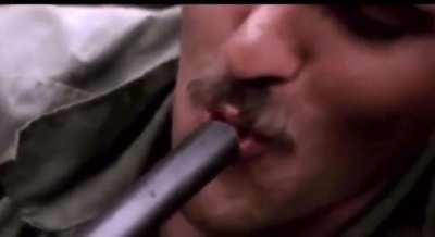 American soldiers in Vietnam smoking Marijuana out of the barrel of a Shotgun, 1970.