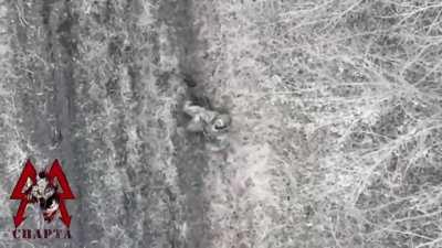 Sparta batallon drone attacking a begging Ukrainian soldier