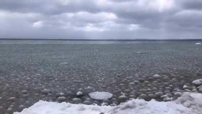 The waves prevent the ice from forming properly and create spherical ice ball