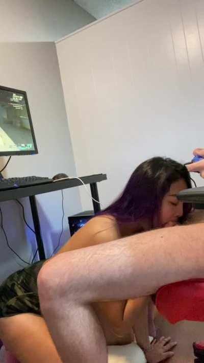 Guy gets his cock sucked while he plays video games
