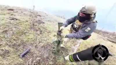 Ukrainian troops using a Carl Gustaf system with HE rounds on a Russian position