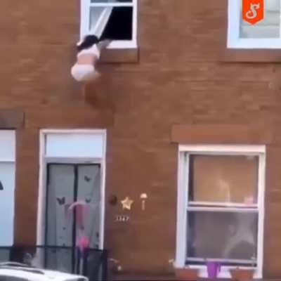 Girl Hanging On The Cornice