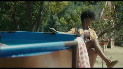 Kiernan Shipka by the pool getting some sun