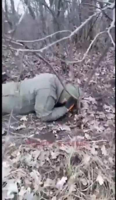 Russian soldier engaging in some tomfoolery with Ukrainian POW who is named Zelensky