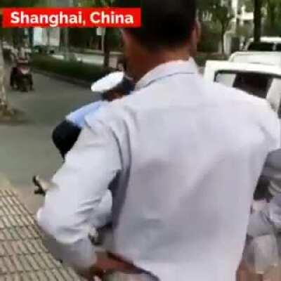 Chinese policeman SLAMS a women while she was holding her baby, the world needs to change. Whatever it takes