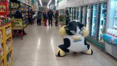 Just a cow happily dancing in the aisle of a market in Mexico