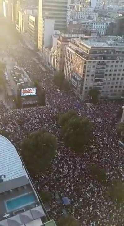 Thousands of people sing 