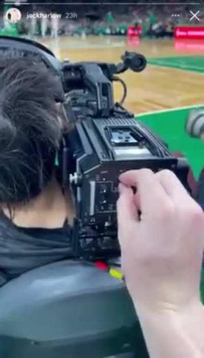 Jack Harlow toying around with camerawoman's camera during Bucks vs Celtic game.