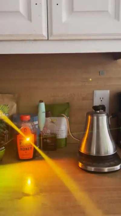 How the honey bottle changes a green laser to orange. Nothing else in the house has that effect.