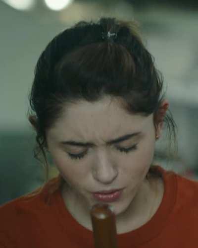 Natalia Dyer making good use of a broom