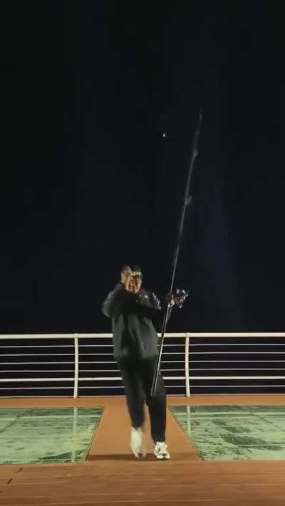 Pro fisher using a beast of a fishing rod.