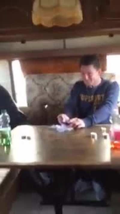 These guys are attempting to eat Surströmming fish, the probably worst smelling fish there is