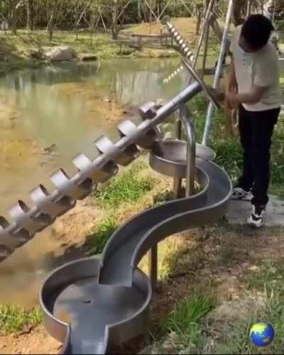 An Archimedes' screw. I’d happily spin the wheel for hours