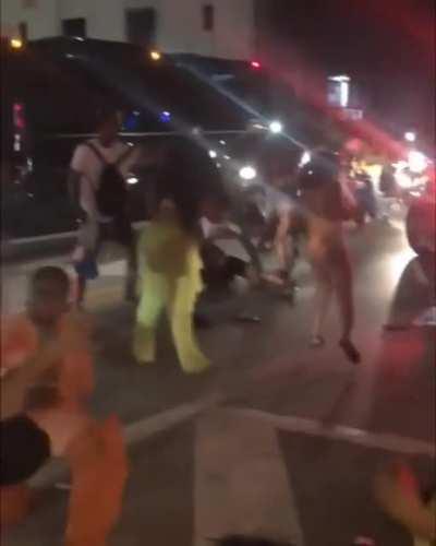 Large group of women brawl in the street (NSFW)