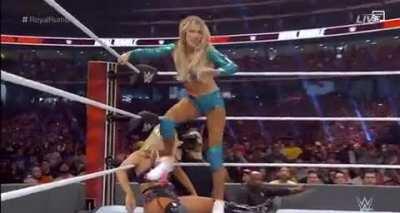 Toni Storm taking a stinkface from Smelly Kelly