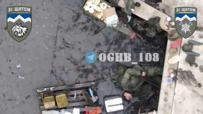 A Ukrainian drone dropping a VOG-17 grenade on a Russian soldier hiding in a bunker