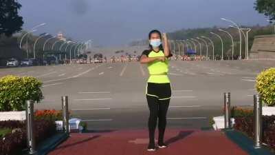 This woman from Myanmar was recording her aerobics class. Unbeknownst to her, she records the military Junta arriving to the parliament for a coup d'etat in the background