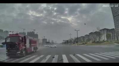 China. Motorcycle and firetruck collision.