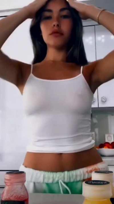 Braless Madison wants us to stare at her pokies as she moves her hair out of the way