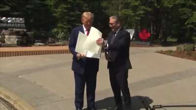 Trump mistakes UK as the EU then drops signed documents