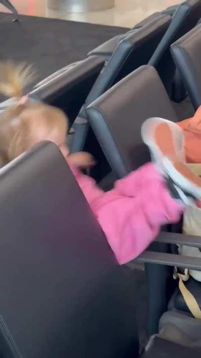 Playing on the airport seats