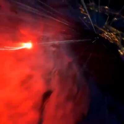 Man wingSuiting with a road flare