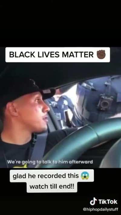 Person is put at gunpoint in car by a cop