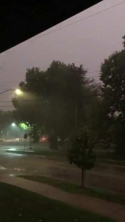 2 minutes of massive downpour in Minnesota, accompanied by thunder and wind chimes.