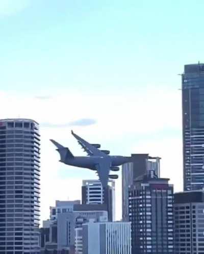 Flying a Boeing C-17 Globemaster through the middle of the city.