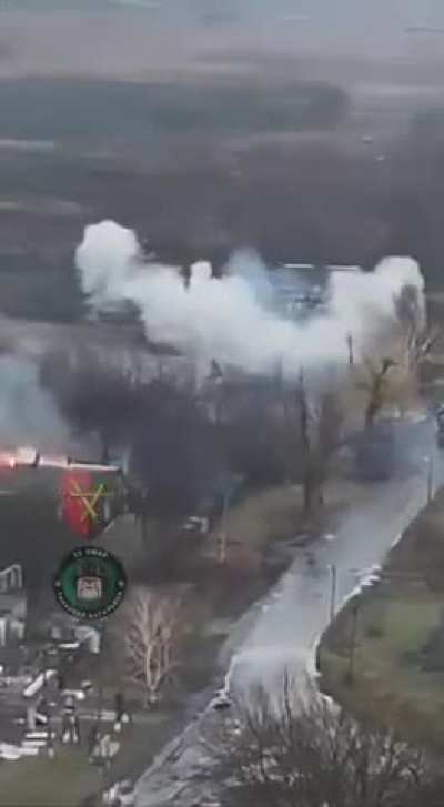 Drone footage of a Ukrainian tank crew by the 32nd Mechanized Brigade shooting at houses occupied by Russian soldiers at very close distance