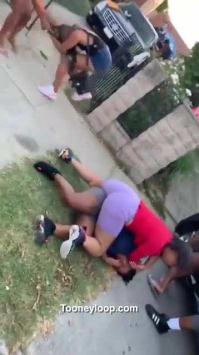 Girl in purple sits nice butt on opponent while she beats her down