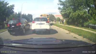 Witnessed an idiot almost hit 2 kids while illegally passing a school bus with its lights on
