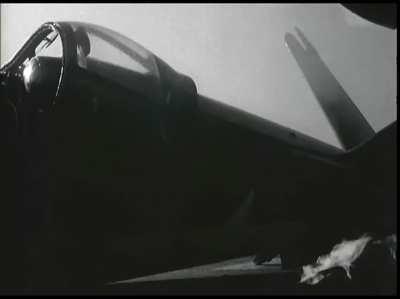 F4U Corsair pilot escapes unhurt after misjudging his approach angle while landing on USS Guadalcanal in July 1945