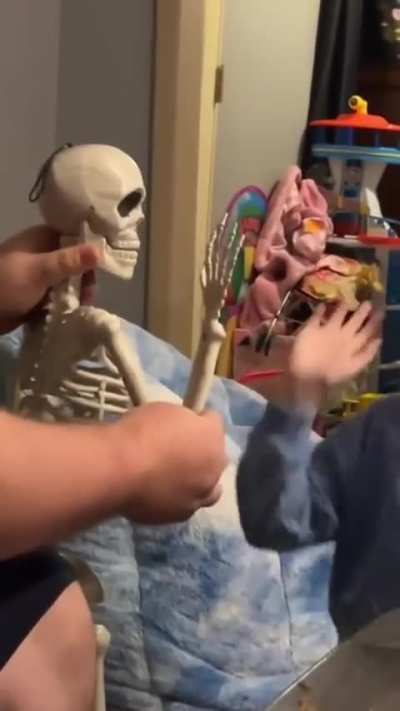 Give a high five to Mr. Bones