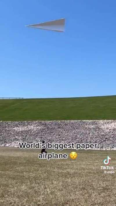 Flying a paper airplane but bigger