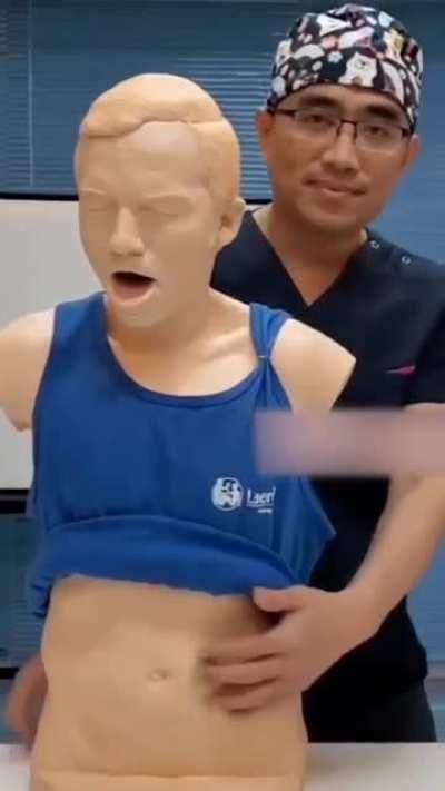 Demonstrating the Heimlich maneuver.